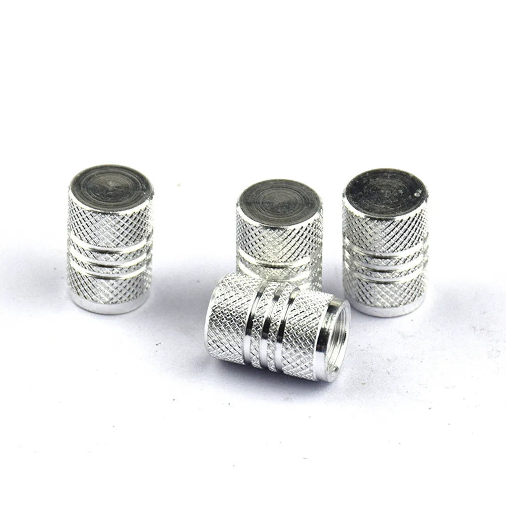 Set of stainless steel car tyre valve caps in assorted colours: black, red, blue, gold, silver, green, purple, sky blue, grey, orange.