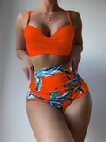 Yellow floral print women's bikini set with push-up bra and high-waist briefs on a mannequin.