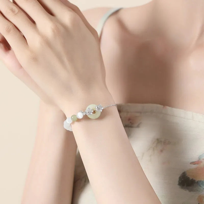 Women's pure silver safety buckle bracelet with peach blossom flower design in New Chinese style