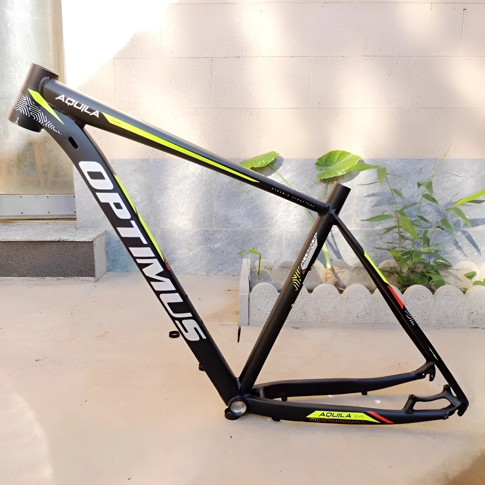 Black Green 29-inch aluminium mountain bike frame showing disc brake mounts and internal cable routing ports.