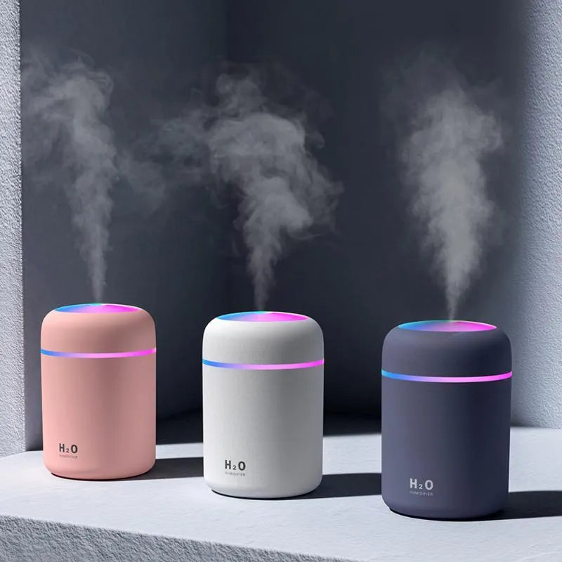Car USB colourful cup air humidifier in pink with USB cord and water tank visible, compact design for cup holder use