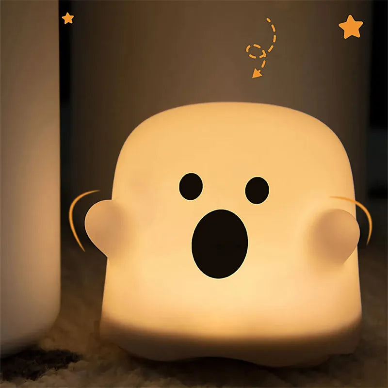 White silicone bedside night light with touch sensor base on wooden table