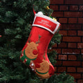 Red Christmas stocking with elk and snowman pattern, made from non-woven fabric with hanging loop.