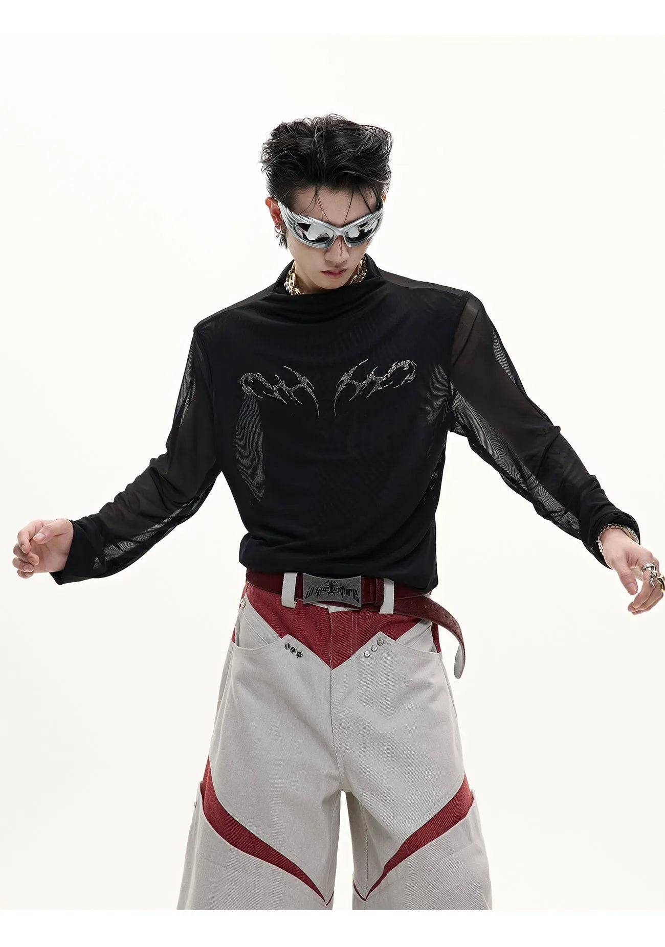 Slim-fit long-sleeved mesh shirt in black, shown as a base layer for athletic wear.