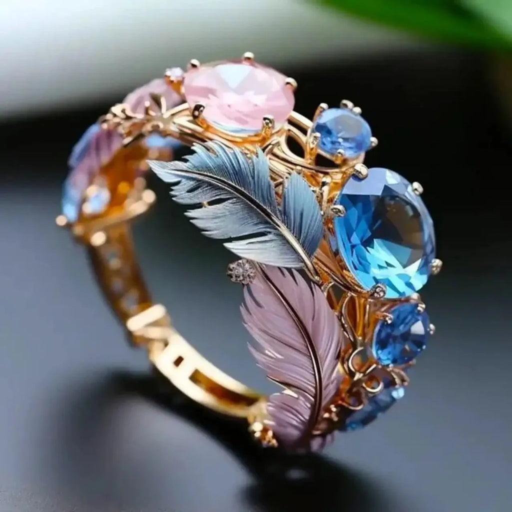 Embossed feather ring with colourful zircon detailing on geometric brass band