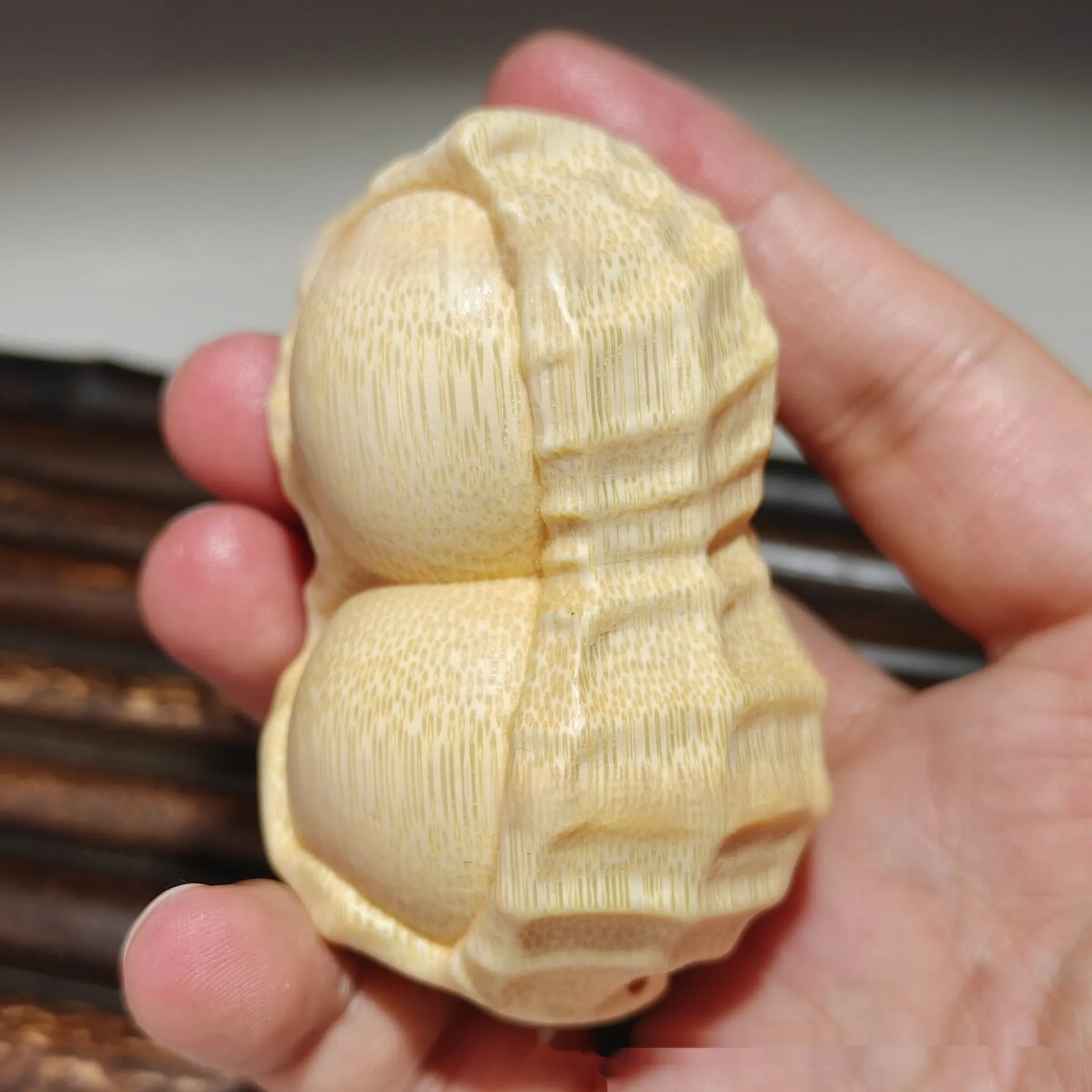 Natural solid bamboo peanut ornament with 'May Good Things Happen' engraved message.