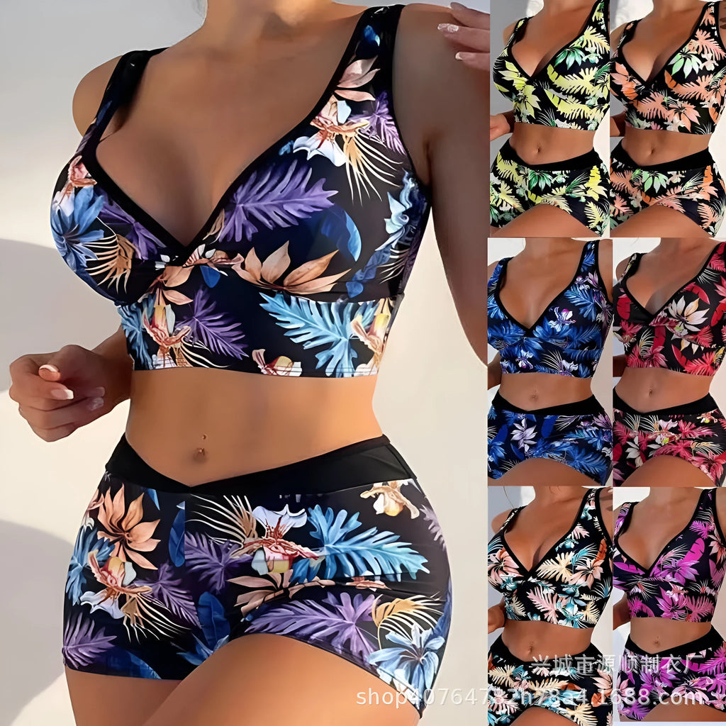Women's two-piece printed boxer swimsuit set in a multi-colour pattern, showing sleeveless top and briefs.