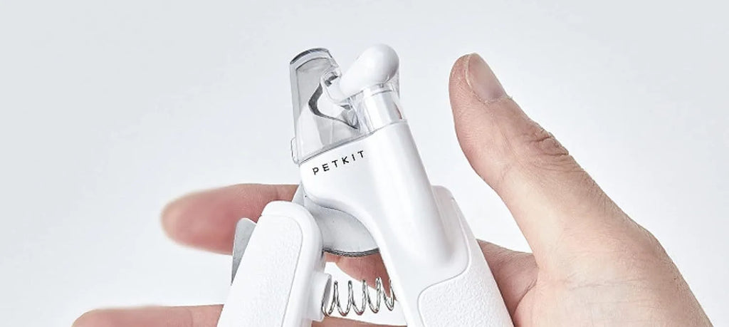 White LED pet nail clipper for cats and dogs with transparent anti-splash guard and file.