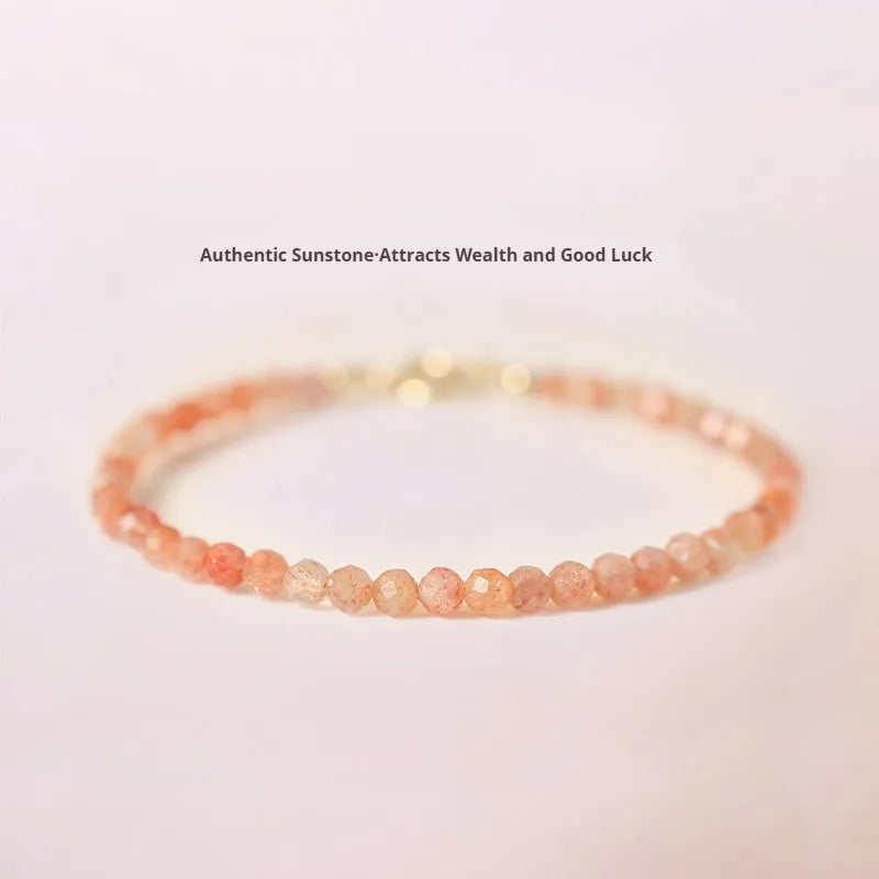 Close-up of a women's bracelet with small 3mm sunstone crystal beads on a wrist, showing its thin profile.