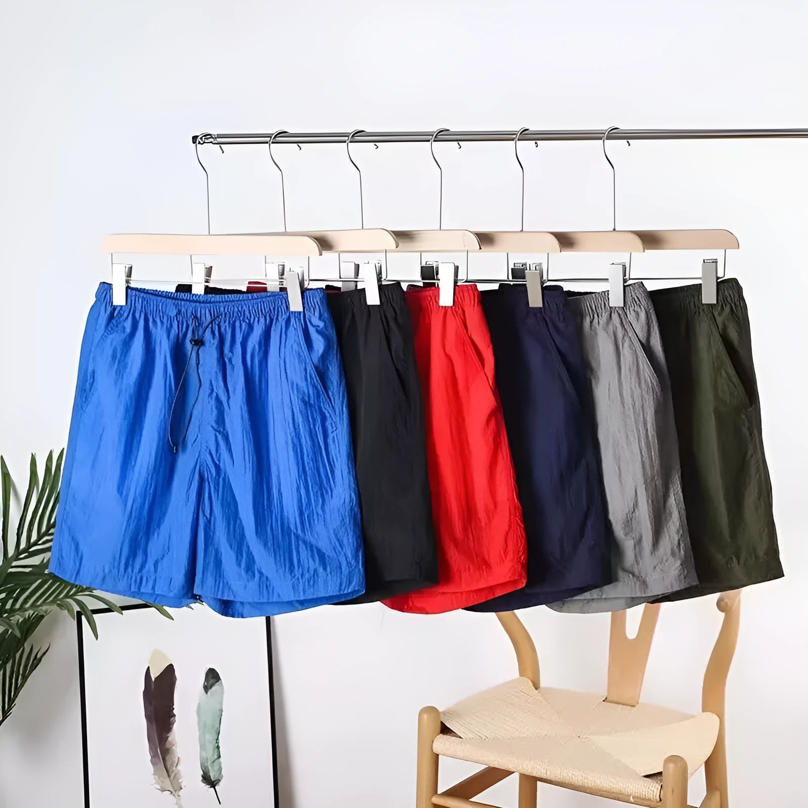 Men's straight cut polyester sports shorts in army green, black, blue, or gray colours