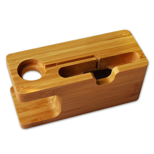 Bamboo carved phone stand with round carving design on office desk, 149mm tall smartphone holder