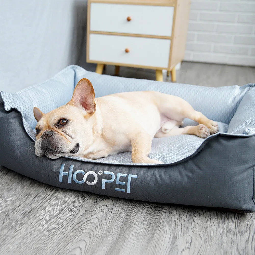 Soft grey dog bed with raised sides and a removable cover, shown in medium size.