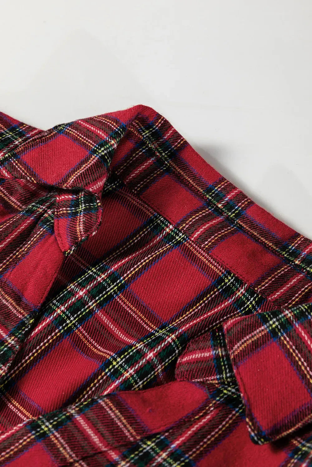 Red plaid shirt collar mini dress with half-button front and ruffle hem detail