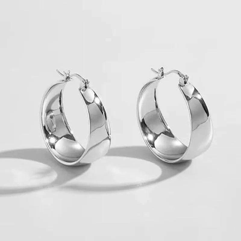 Stainless steel curved earrings with electroplated gold or steel finish in 25mm or 30mm sizes