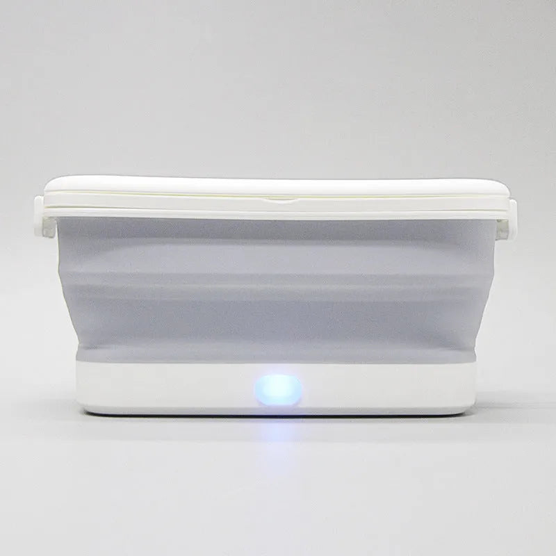 Foldable UV disinfection box with aromatherapy and drying function on a table