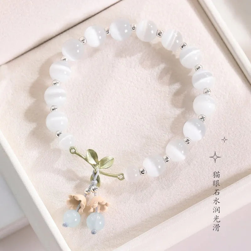 Women's cat's eye stone beaded bracelet with diamond-shaped opal beads and electroplated metal clasp in one of sixteen colour options
