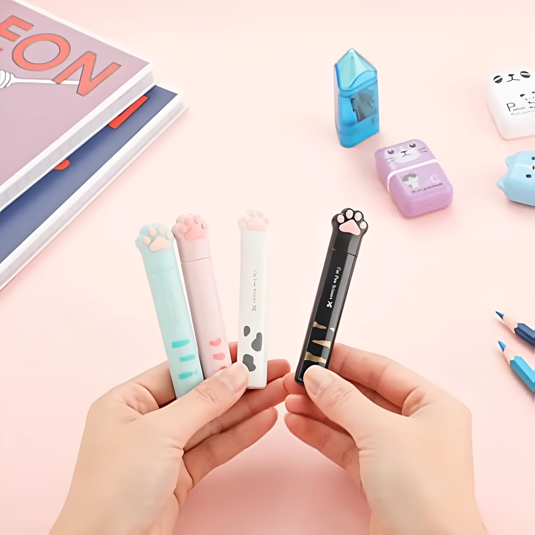 Cat paw design mini folding scissors in four colours showing stainless steel blades