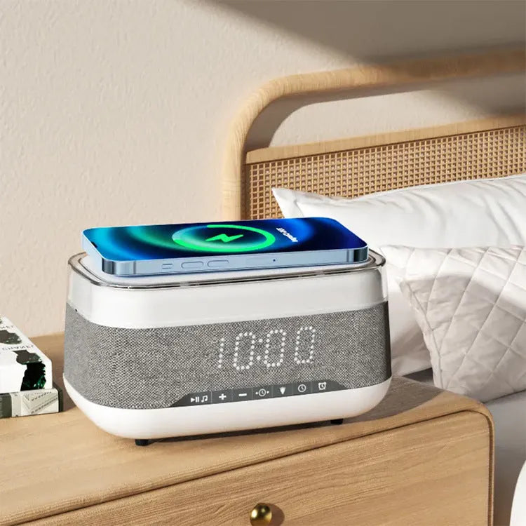 White multifunctional alarm clock with Bluetooth speaker and wireless charging pad display