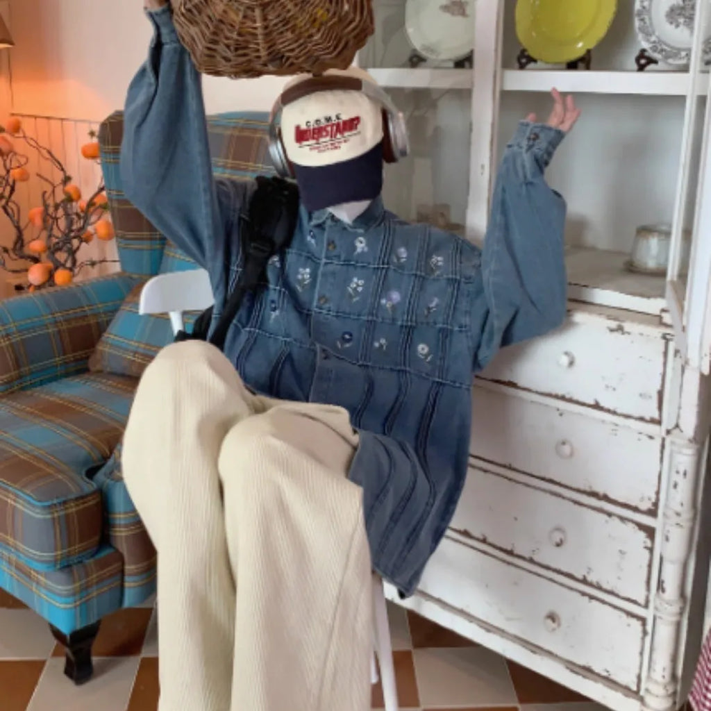 Vintage washed blue denim shirt with small floral print and pleated front on long sleeves