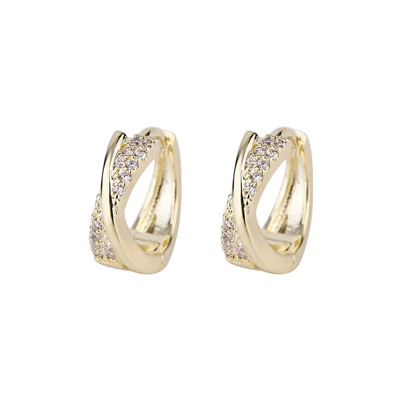 Geometric copper earrings with zircon treatment in 14K yellow colour, showing structured design and clean lines