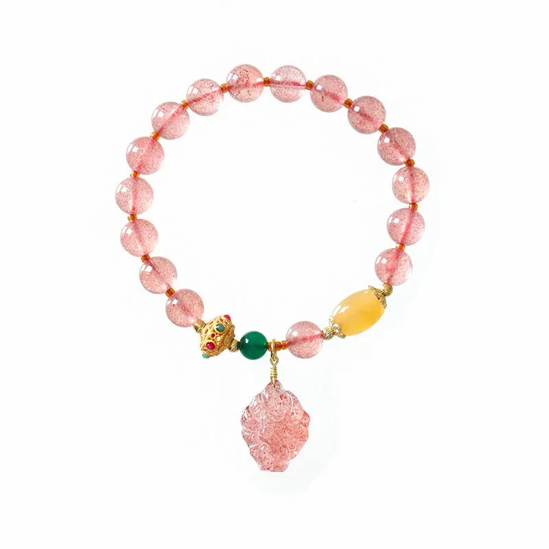 Women's Nine Tail Fox design bracelet with polished strawberry quartz crystal beads.