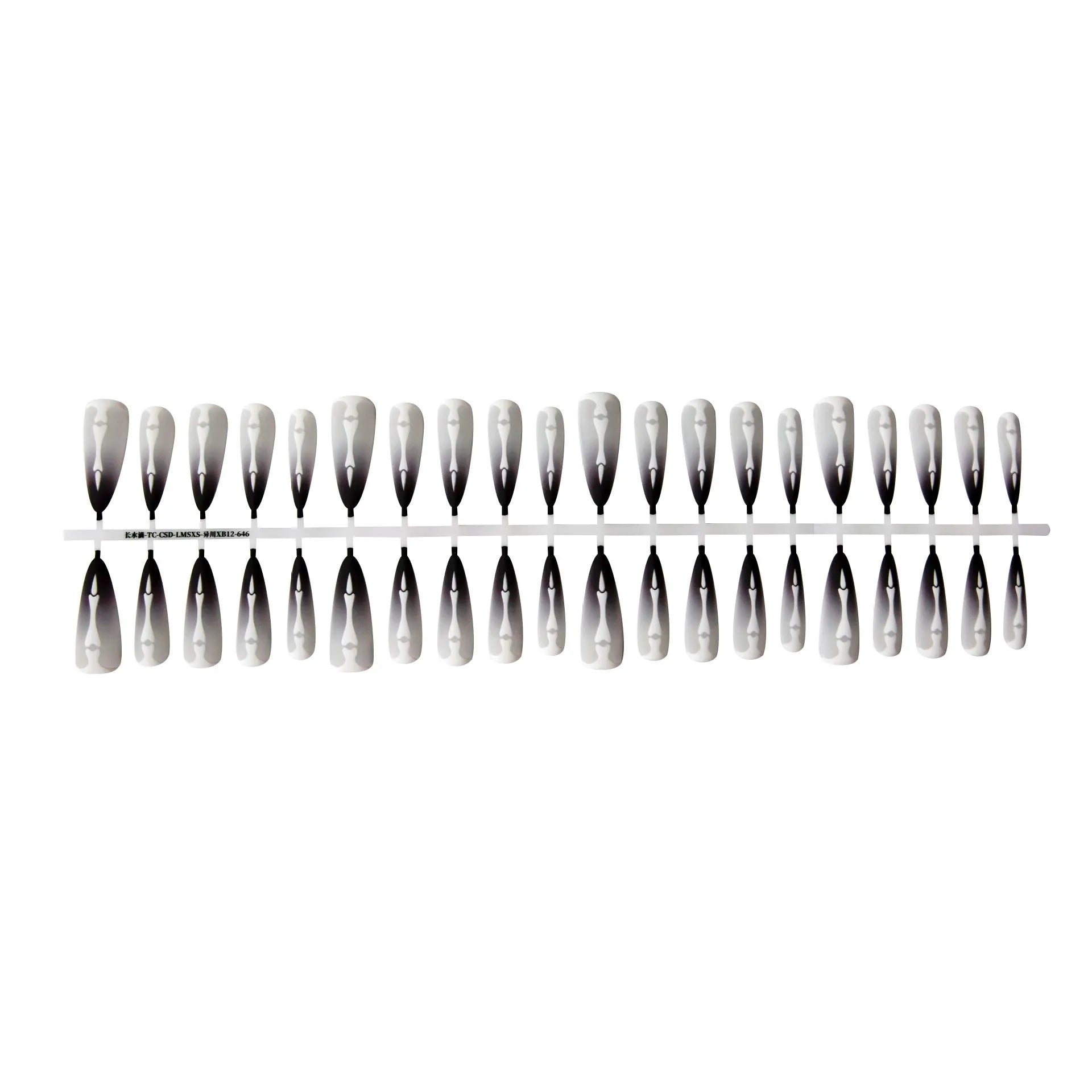 Close-up of long black and pink Christmas gothic nail tips with frosted finish on a flat surface, next to a storage strip.