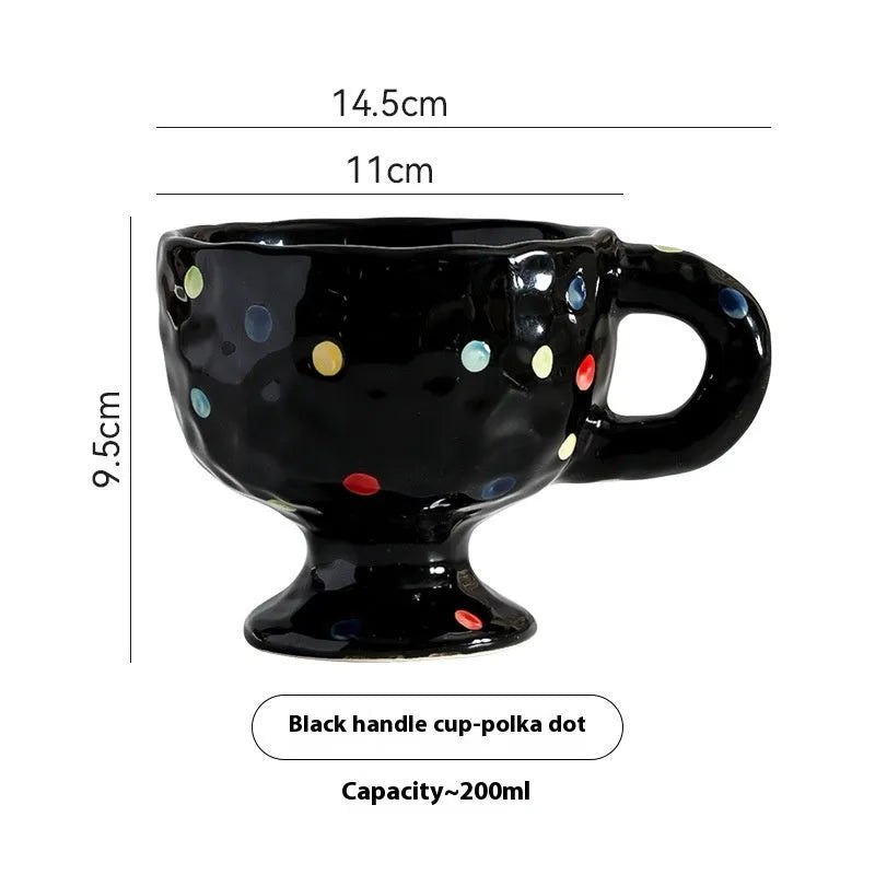 Hand-pinched irregular ceramic mug showing solid colour and unique shape