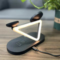 Black 3-in-1 wireless charging station showing phone, Apple Watch and AirPods charging simultaneously.