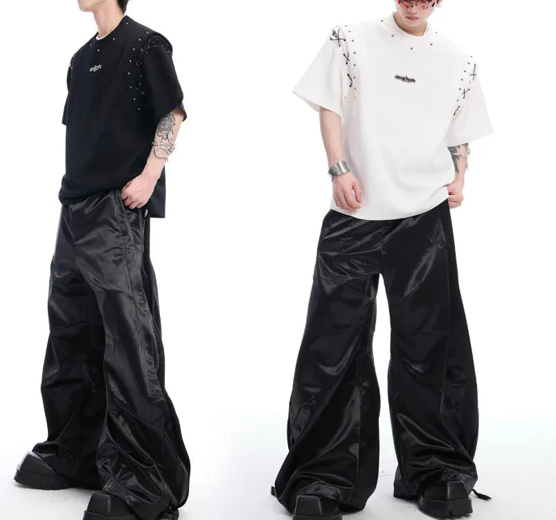 Women's black deconstruction t-shirt with a front lace-up cutout detail and short sleeves.