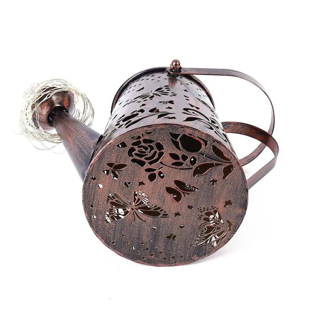 Solar garden lamp with tapered butterfly pattern iron frame and white LED light