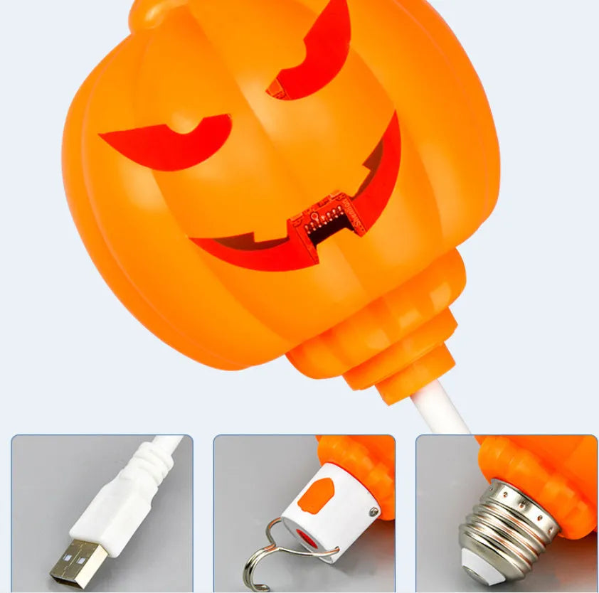 Plastic pumpkin-shaped lamp glowing with either purple or yellow light, measuring 22cm tall.