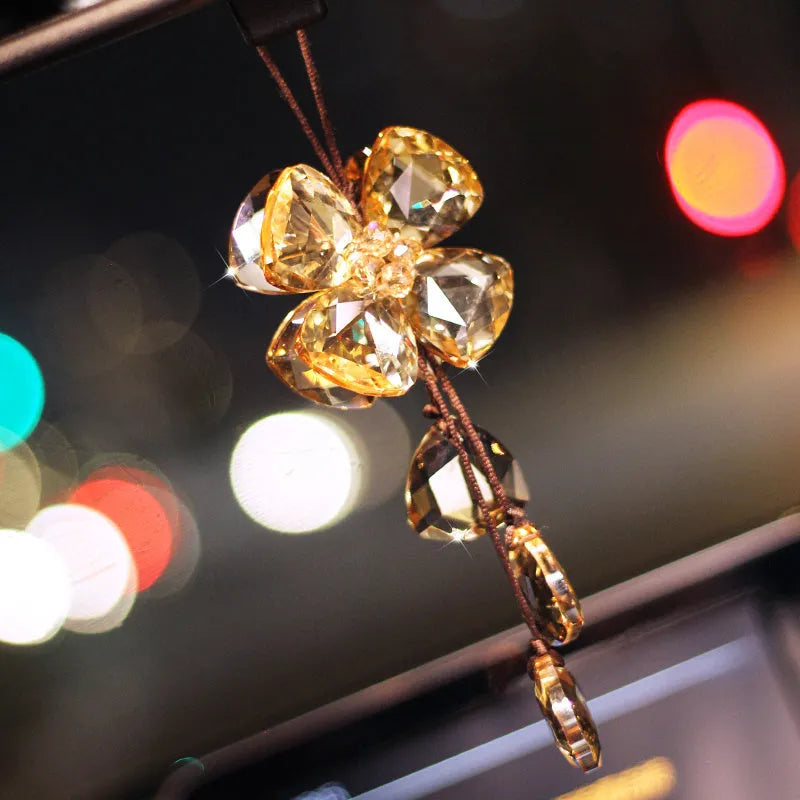 Crystal Four Leaf Grass car pendant hanging, showing its approximately 20cm size and transparent finish.