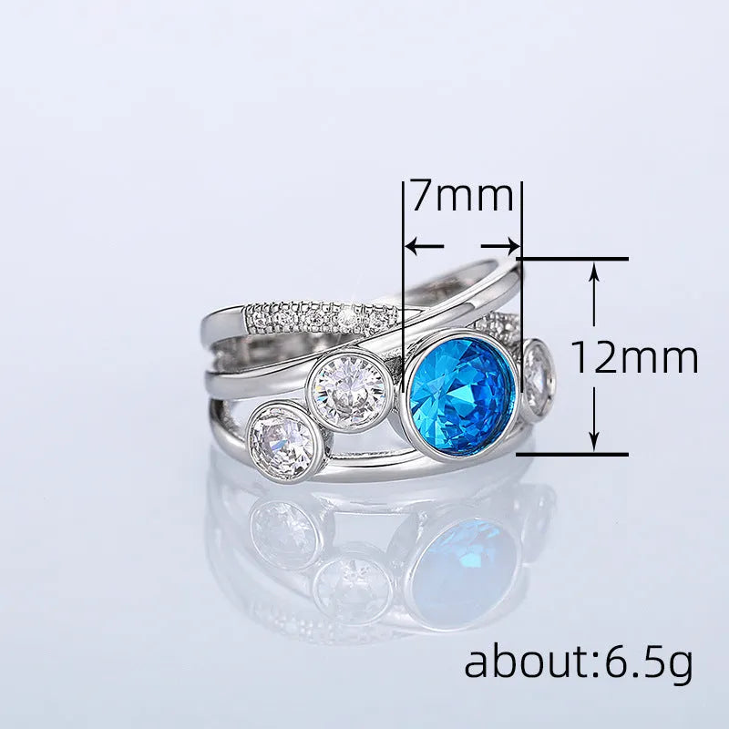 Retro hollow inlaid round copper ring in white gold colour with zircon stones