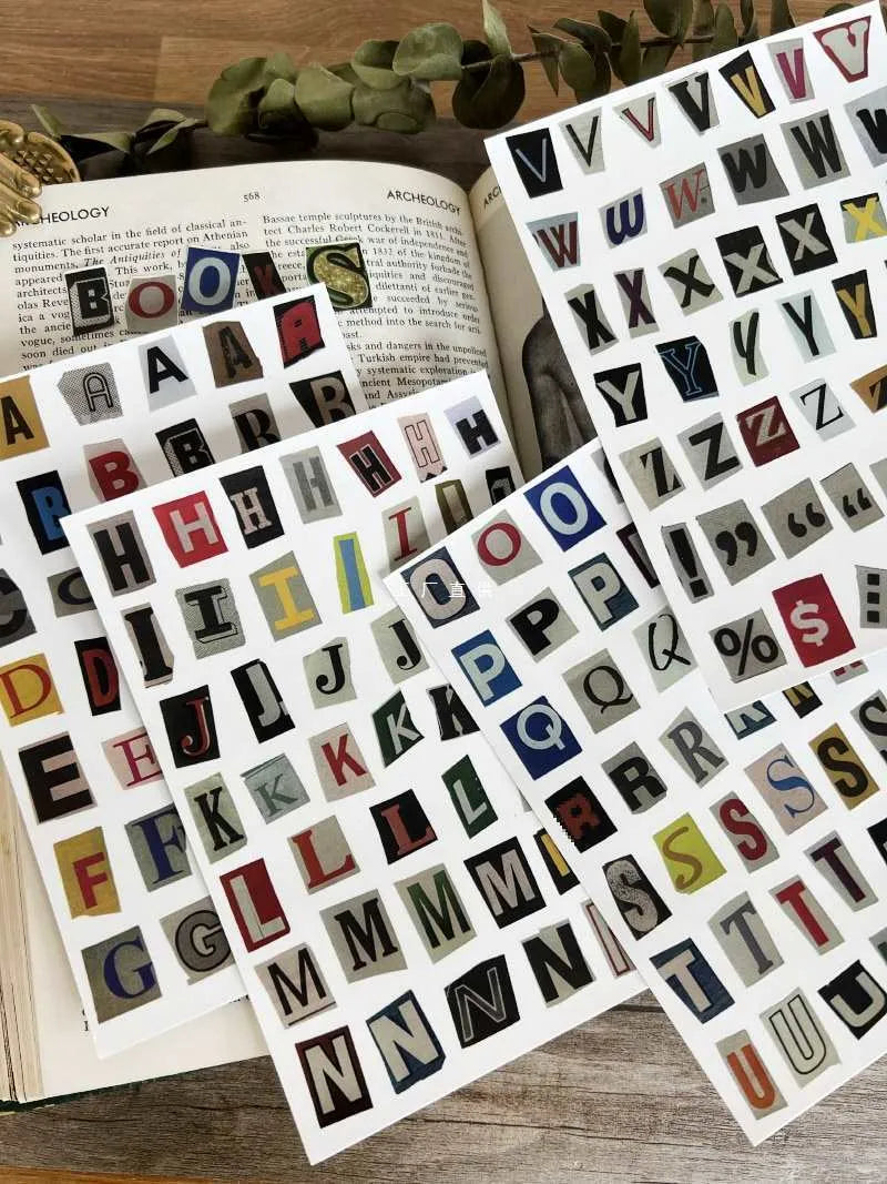 Sheet of cute style decorative stickers showing printed English alphabet letters and weekly words.