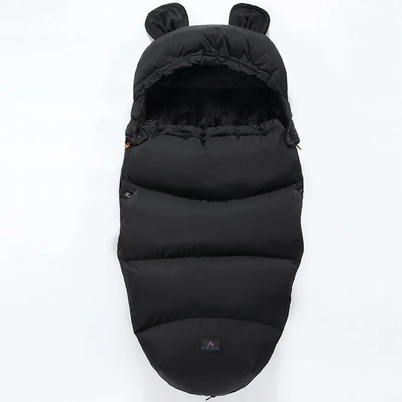 Convertible baby sleeping bag cocoon in a pram, showing cotton blend fabric and flannel lining.