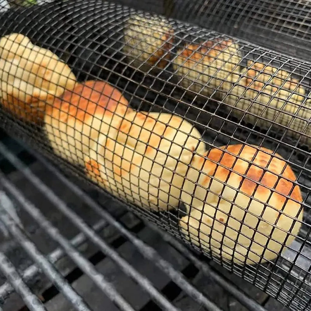 Rolling grill basket iron wire mesh 20x10x10cm with hook, filled with vegetables on a barbecue