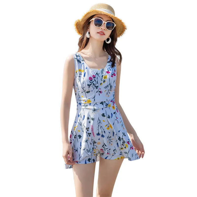 Women's floral printed one-piece swimsuit in white or lavender colour made from polyester fabric