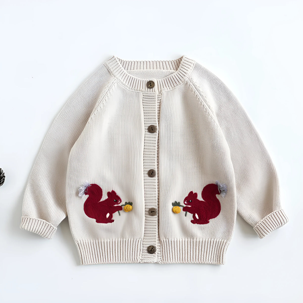 Kids cotton knit sweater with squirrel embroidery in beige colour on white background