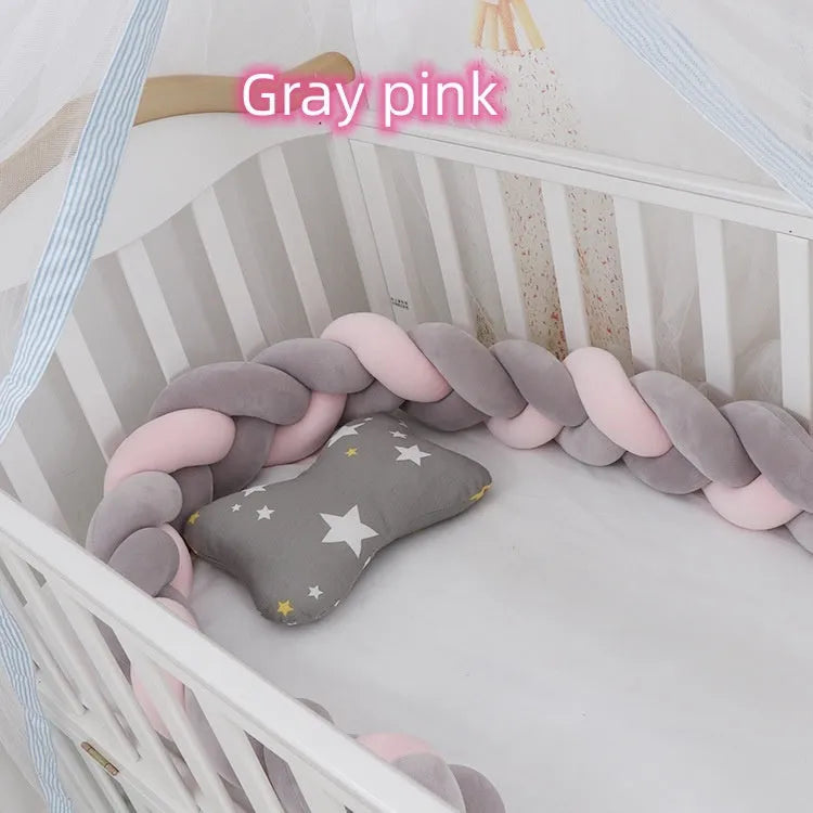 Baby cot bumper braid in spandex crystal velvet, shown in a light grey colour, wrapped around white crib rails.
