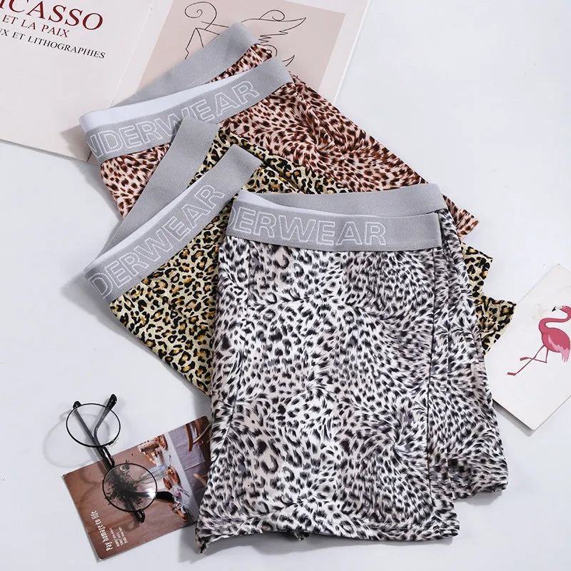 Men's loose fit leopard print underwear in grey and yellow, showing mid-waist design and soft fabric texture.