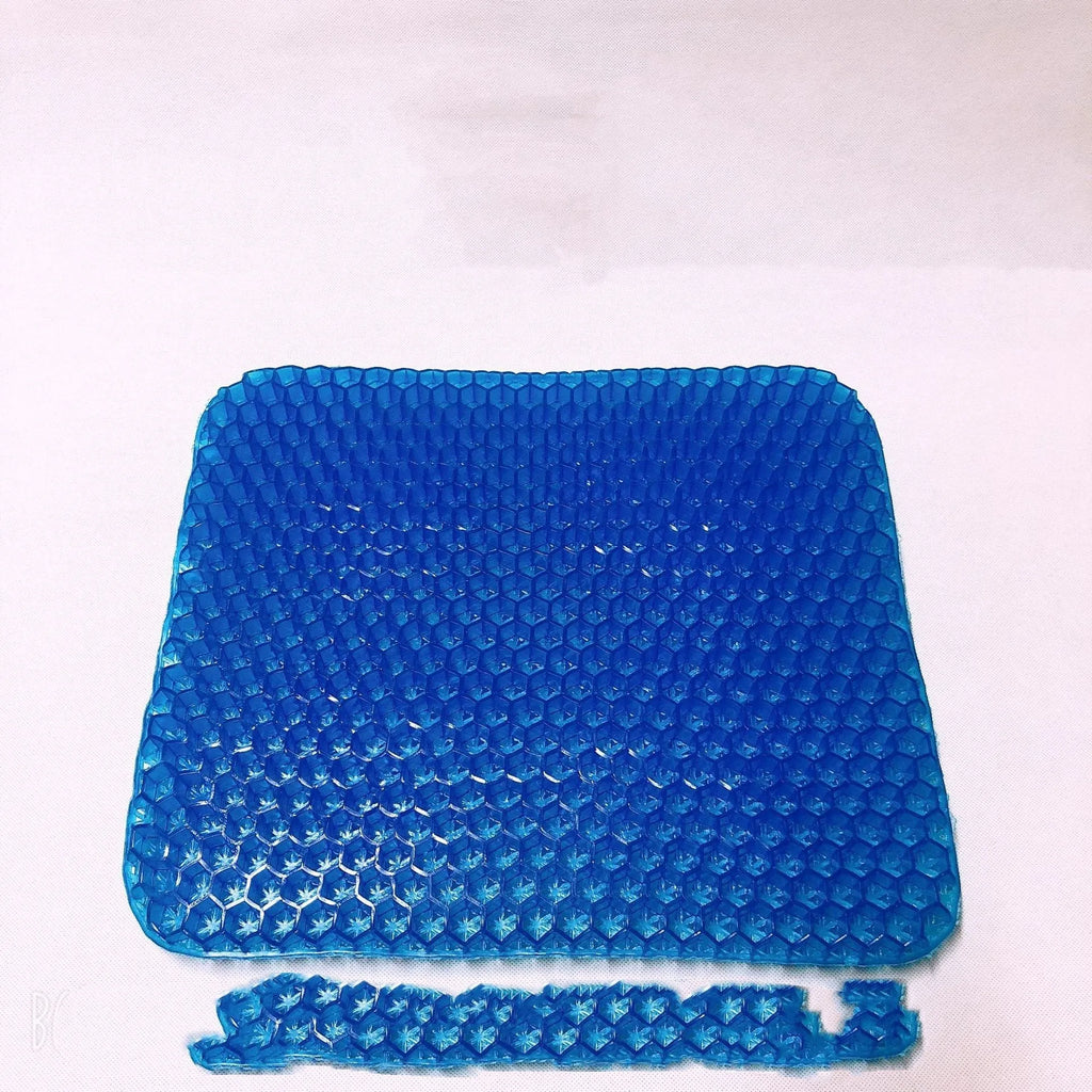 Solid colour gel seat cushion with honeycomb cooling design shown on a chair.