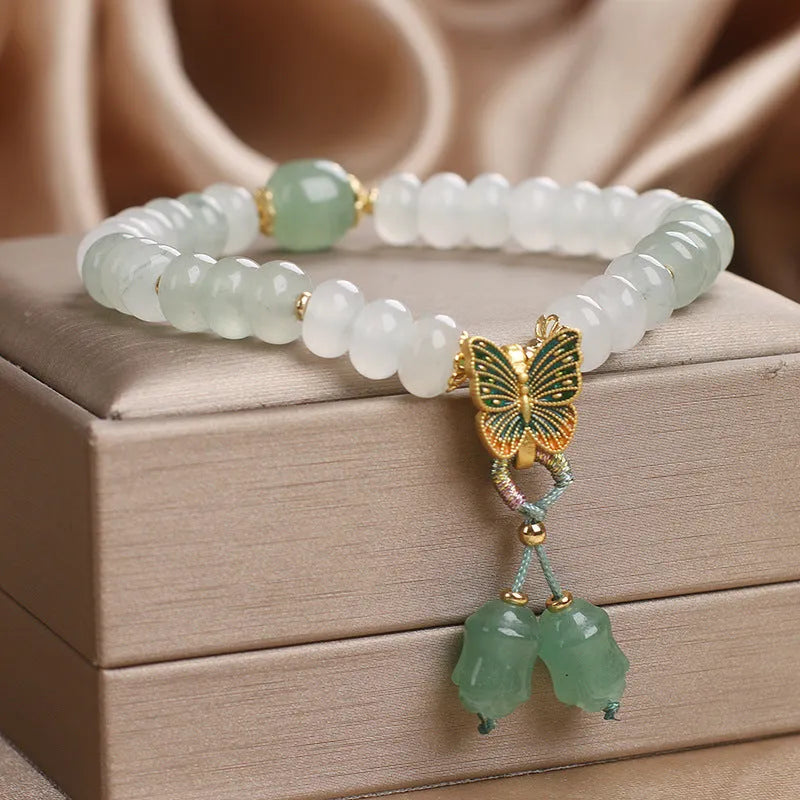 Green Tian Shan Cui abacus bead bracelet with crystal detailing and butterfly tassel