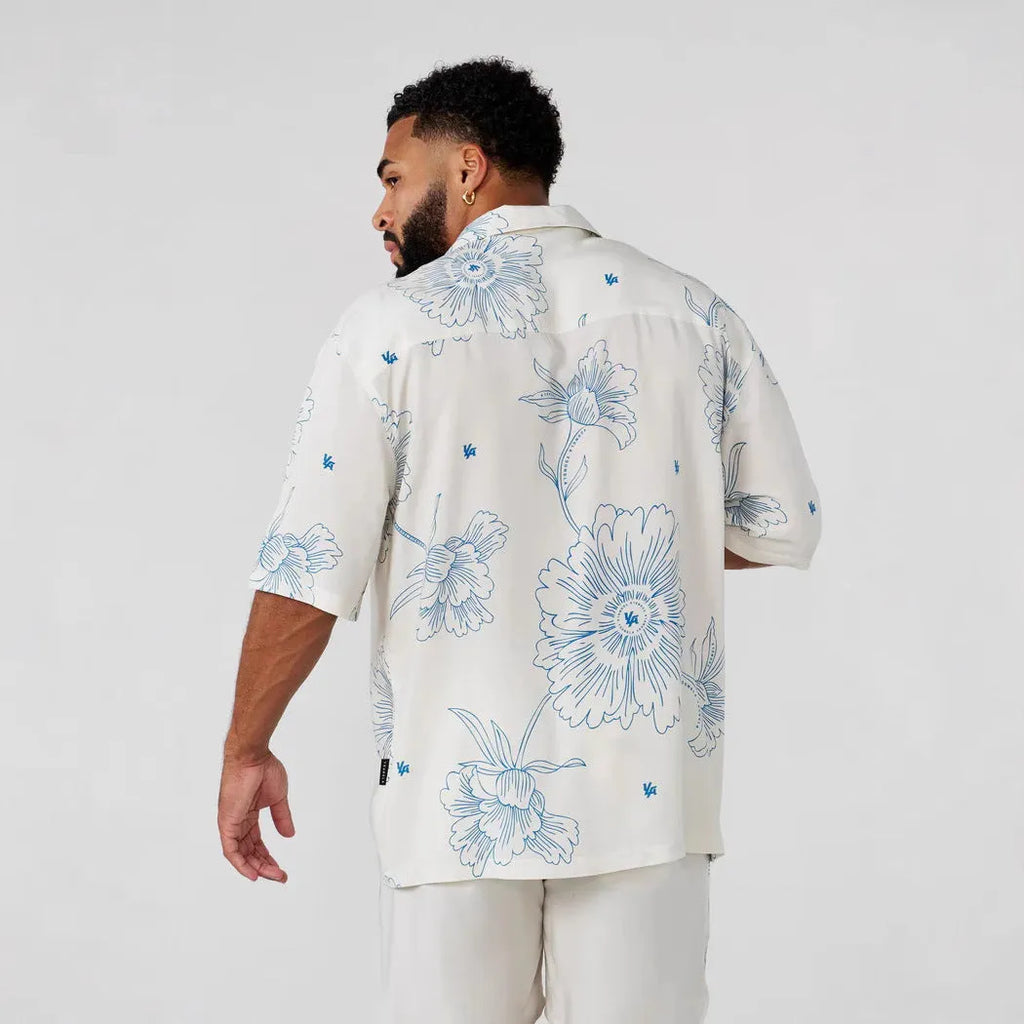 Men's printed casual loose short sleeve top in beige with floral pattern, short sleeves, and cardigan style