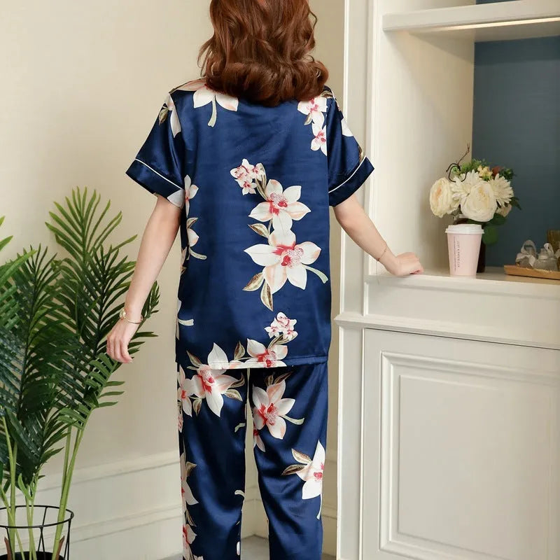Women's two-piece short-sleeved pyjama set in begonia print with trousers, shown on a model