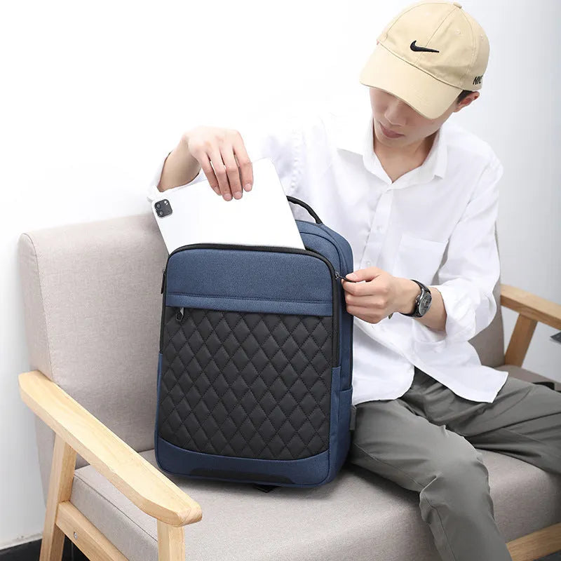 Men's black Oxford cloth travel backpack with curved shoulder straps and diamond mesh back panel