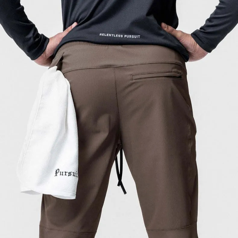 Men's loose grey running pants with ankle ties, quick-drying polyester fitness trousers for exercise