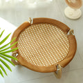 Brown woven rattan off-ground hammock bed for cats and small dogs.