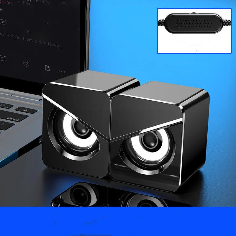 Black USB wired mini desktop speaker with volume knob next to white version, both measuring 7.5cm wide