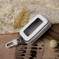 White genuine leather car key case with a plain weave pattern, shown in a square vertical design.