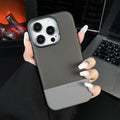 Black magnetic iPhone case with dragon scale texture and stitching, shown on an iPhone.